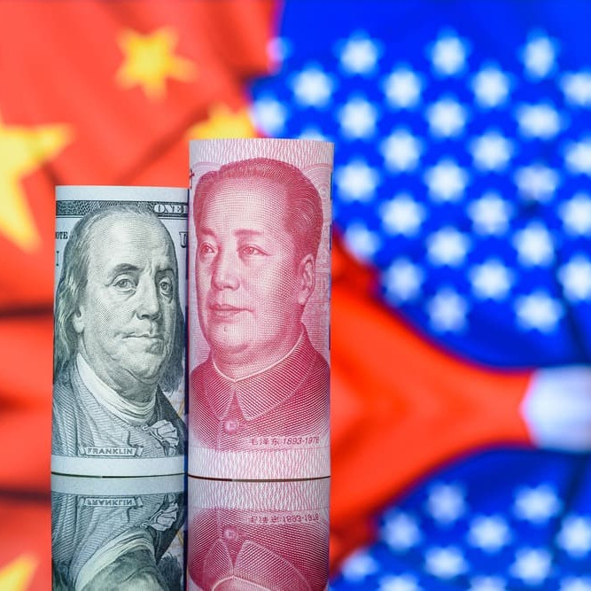 Les monnaies Yuan et Dollar, symboles de la guerre commerciale entre la chine et les etats unis